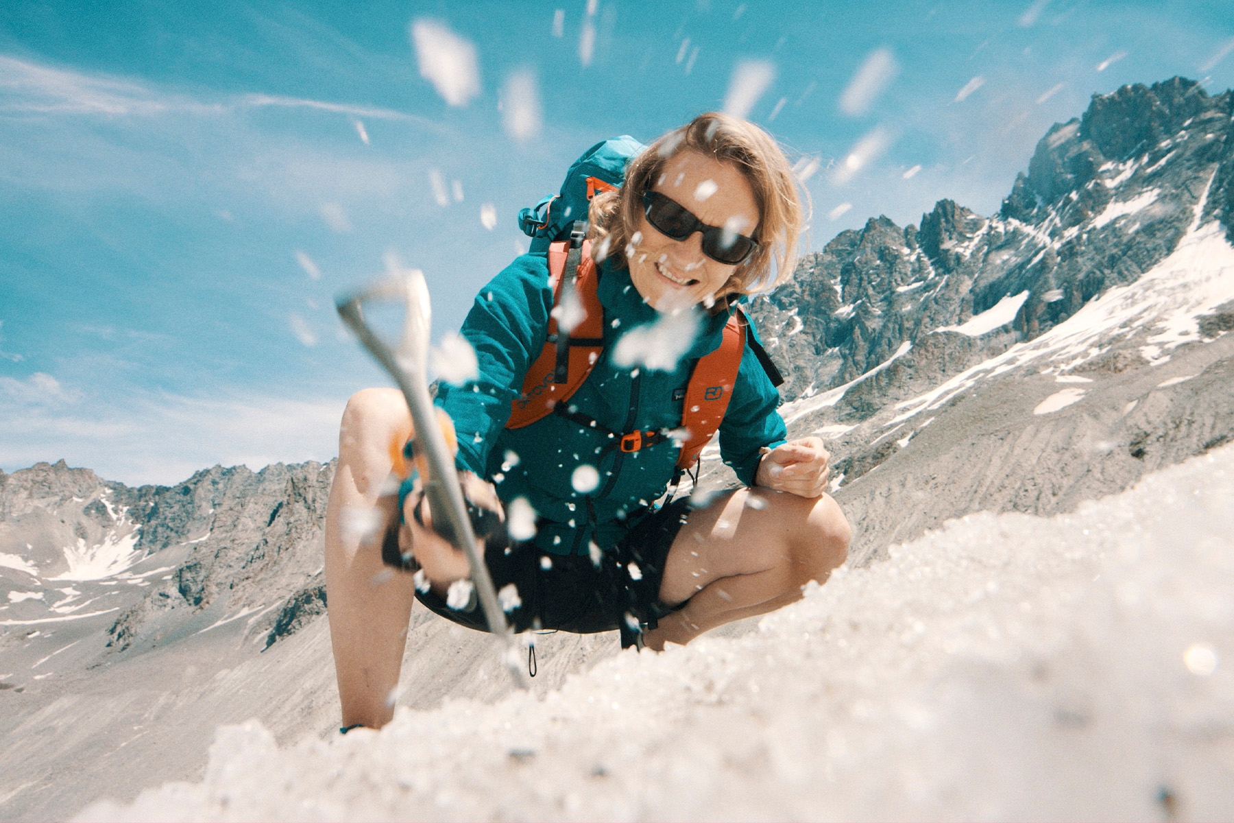 A photograph of Jemma Wadham climbing a mountain