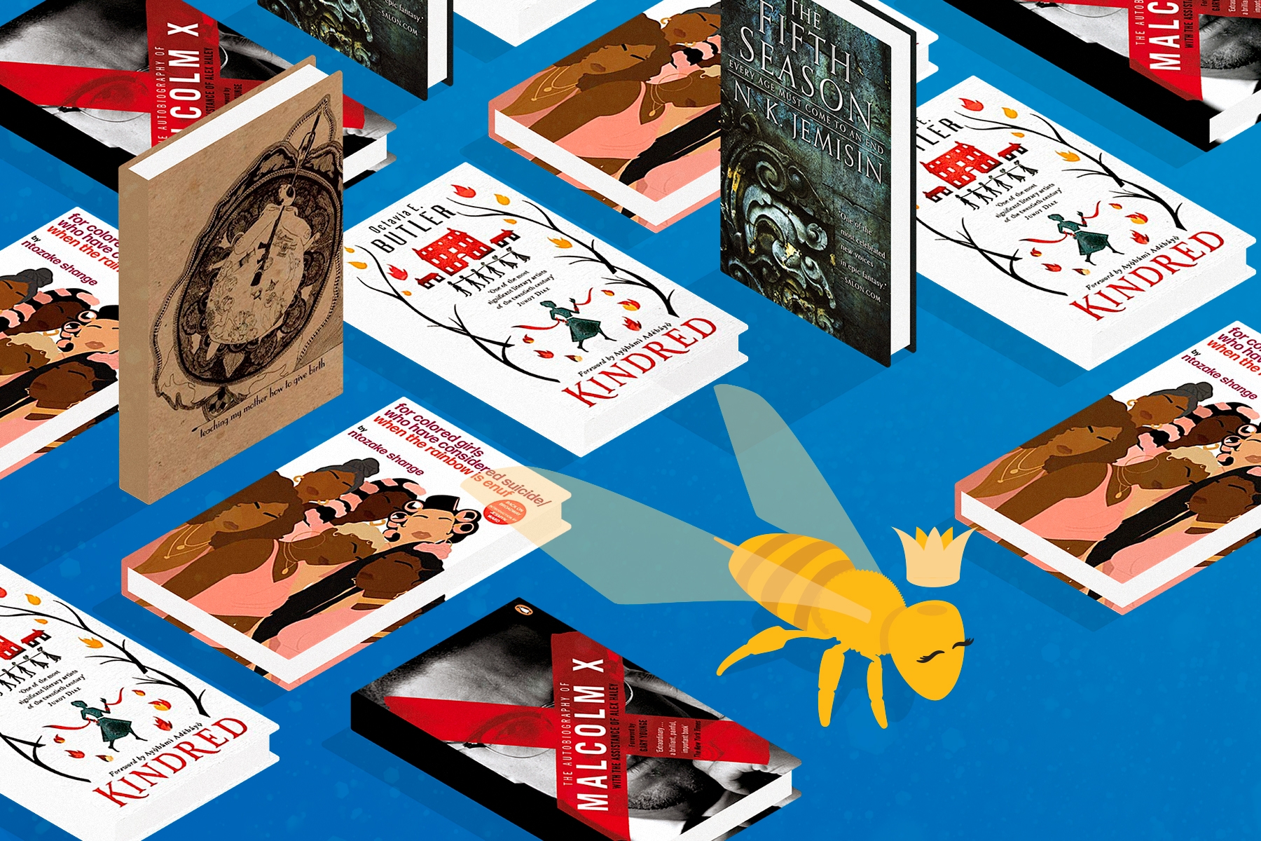 A flatlay of books standing up and laying down on a blue background, with a yellow bee with a crown in the front